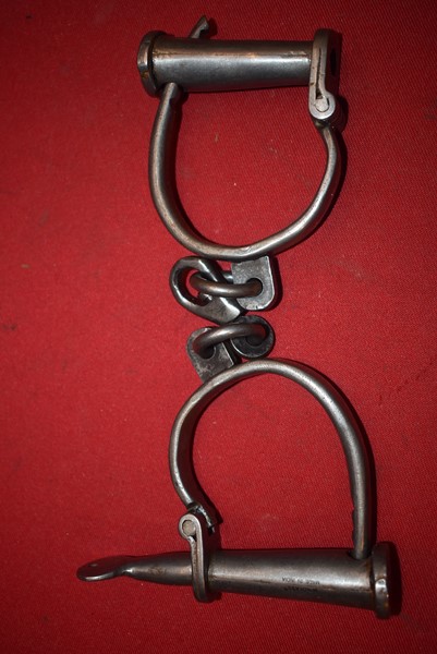 PAIR OF IRON HANDCUFFS AND KEY-SOLD