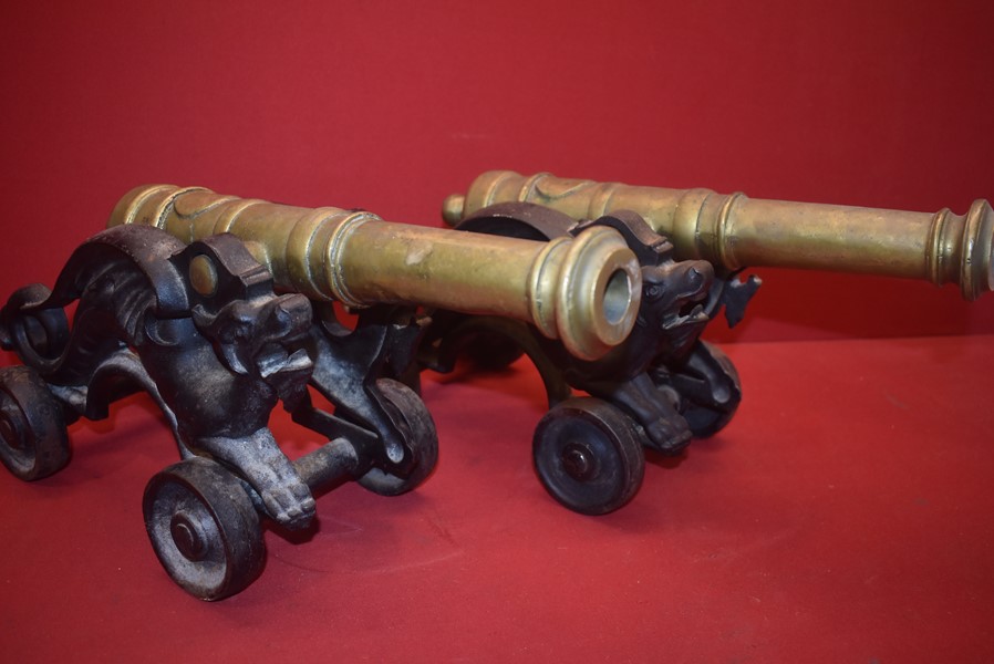 PAIR OF LATE VICTORIAN BRASS AND CAST IRON ORNAMENTAL SIGNAL CANNONS-SOLD