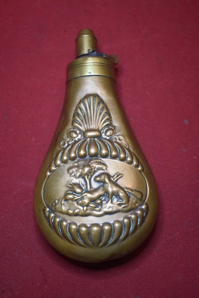 19TH CENTURY BRASS POWDER FLASK WITH HUNTING DOG SCENE.-SOLD