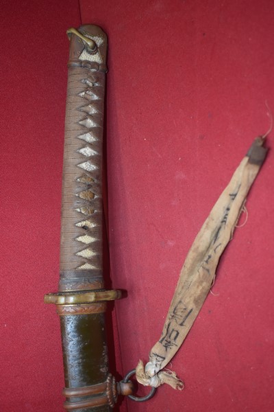 WW2 JAPANESE OFFICERS SAMURAI SWORD WITH SURRENDER TAG AND SIGNED TANG.-SOLD