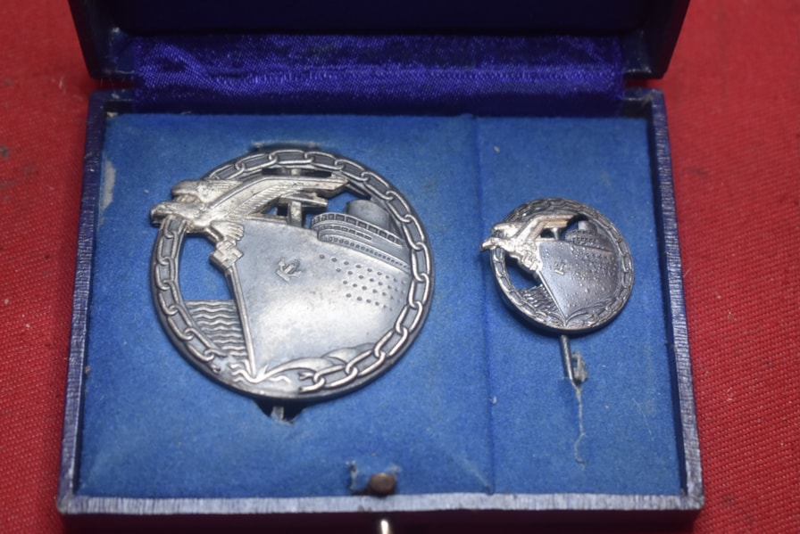 WW2 GERMAN KRIEGSMARINE CASED BLOCKADE RUNNERS BADGE AND MINIATURE STICK PIN
