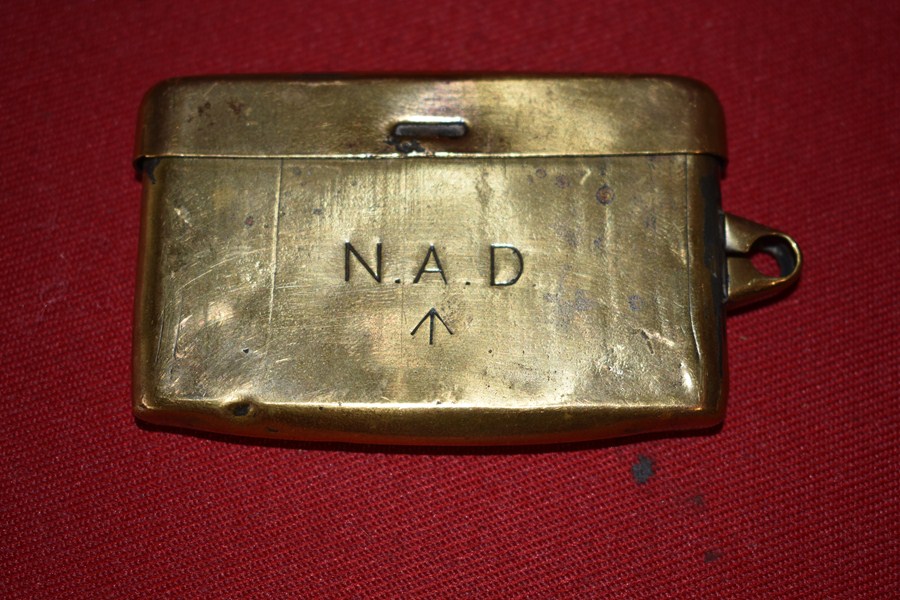 SMALL BRASS TIN MARKED NAD-SOLD
