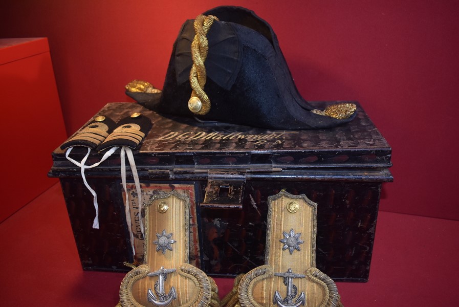 ROYAL NAVAL COCKED BICORN FORE AND AFT HAT WITH GILT METAL KNOT AND, BULLION EPAULETTES IN JAPANNED TIN CASE.-SOLD