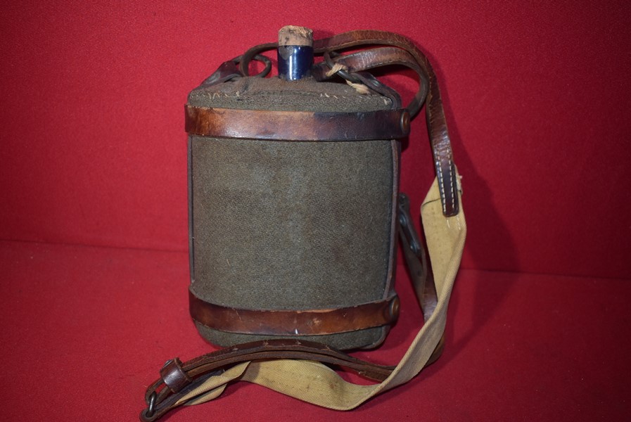 WW2 AUSTRALIAN WATER CANTEEN WITH LEATHER CARRIER STRAPS DATED 1942-SOLD