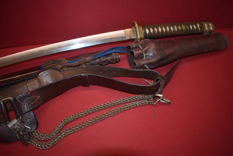 WW2 JAPANESE OFFICERS SAMURAI SWORD COMPLETE WITH BELT, HANGERS, TASSEL AND FOUL WEATHER COVER.-SOLD