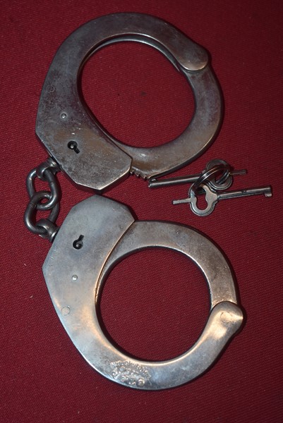 PAIR OF STAR BRAND HANDCUFFS AND TWO KEYS-SOLD