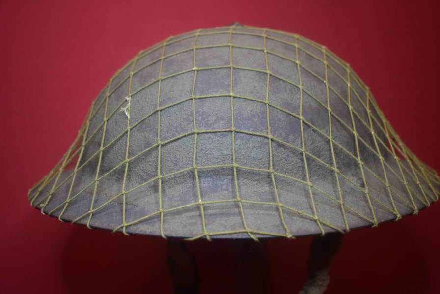 AUSTRALIAN RAW EDGE WW2 ARMY HELMET WITH CAM NETTING COVER