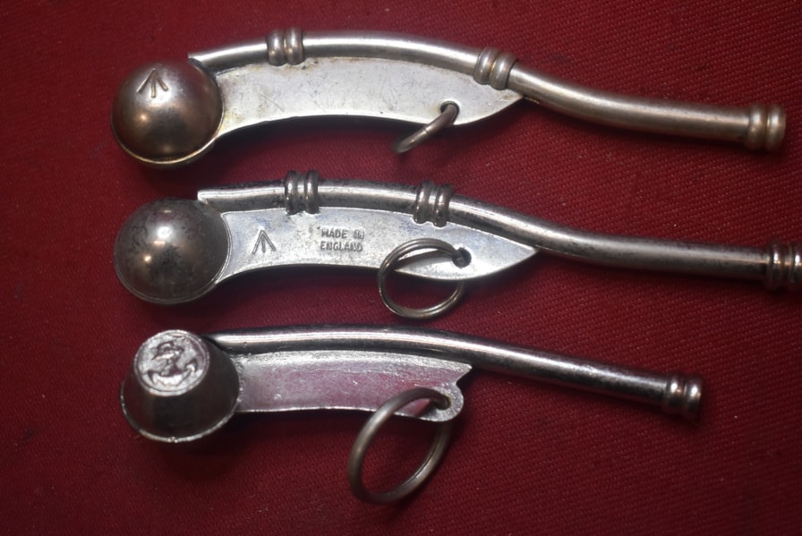 COLLECTION OF THREE BOSUNS WHISTLES-SOLD